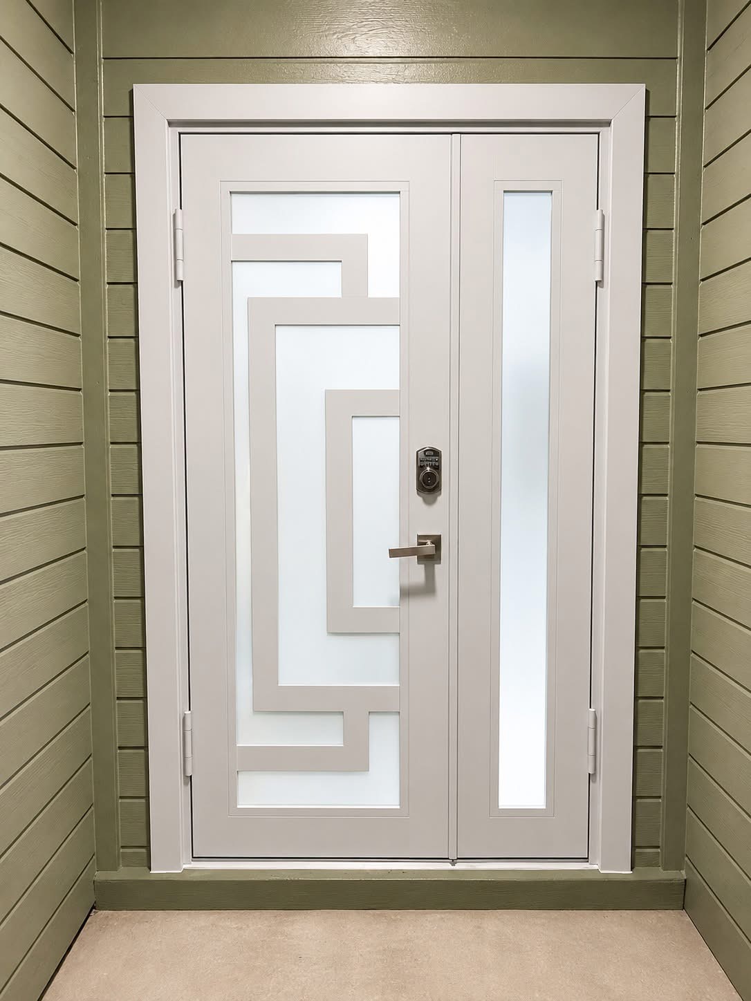 Gray entry door with zigzag geometric design