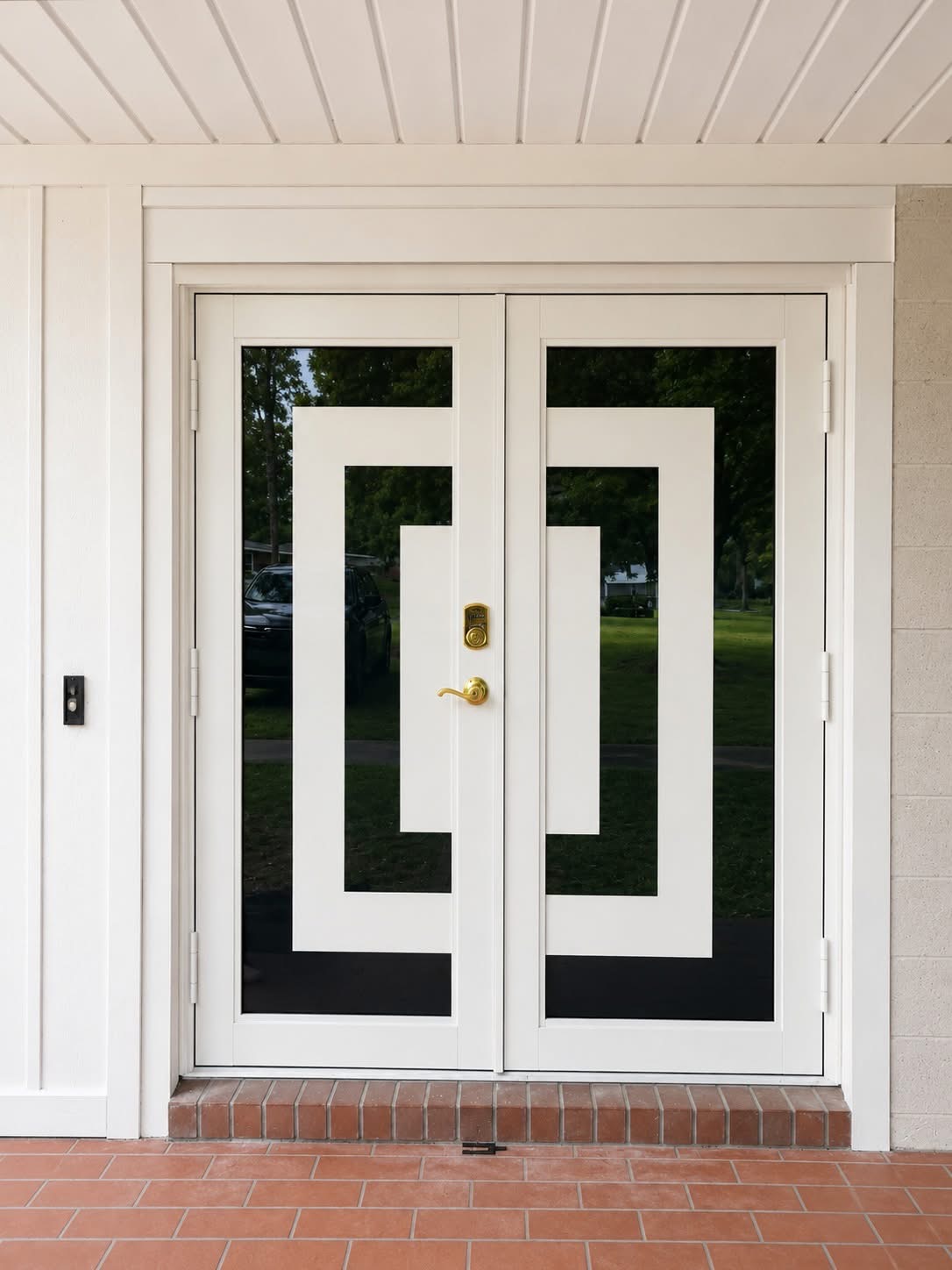 Black entry door with oval motif and arched transom
