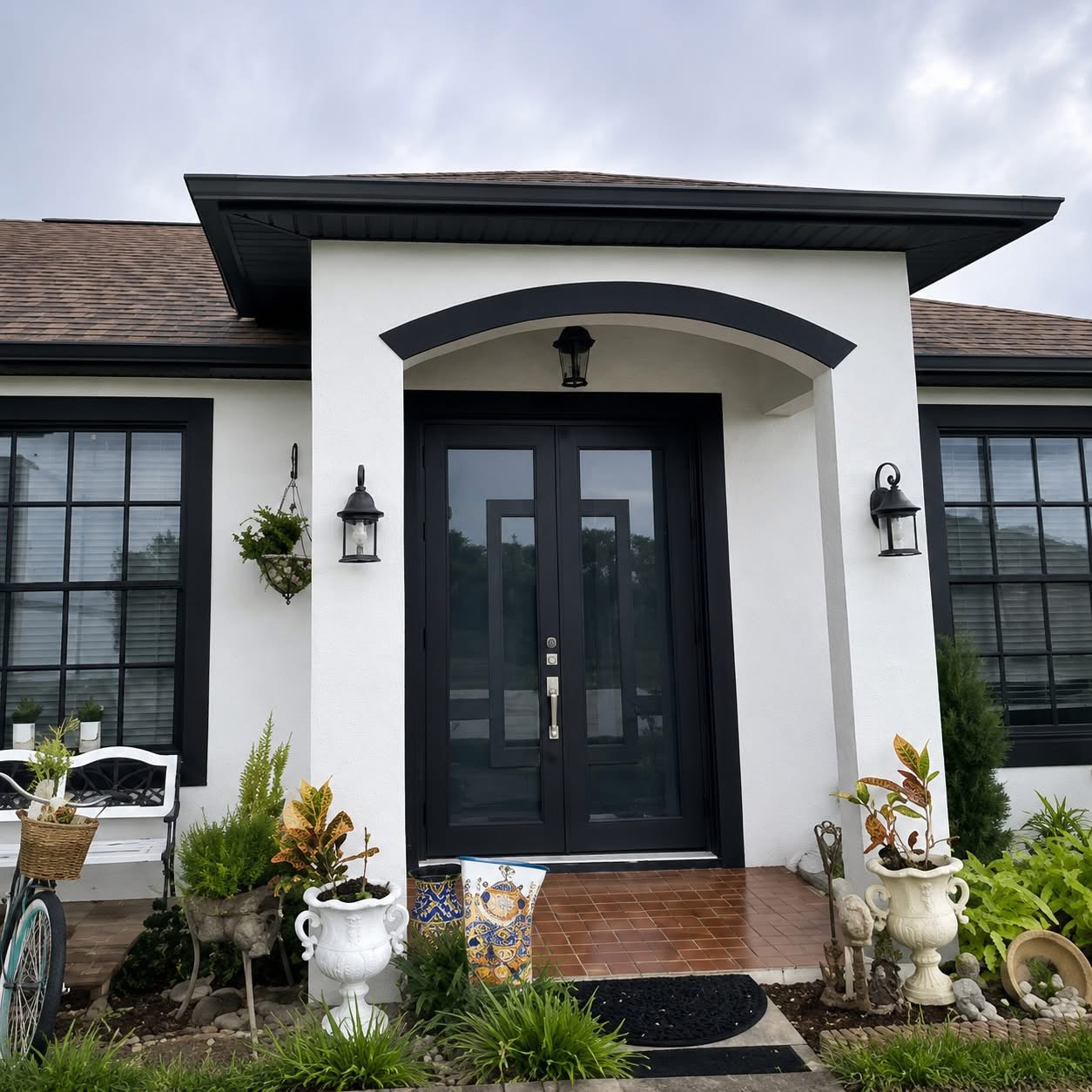 Complete home facade with impact windows and black double entry door